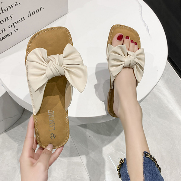 Ženske papuče s ravnim potplatom i trakom pogodne za svakodnevnu upotrebu