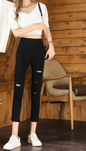 Naiste musta värvi rebenenud motiividega retuusid