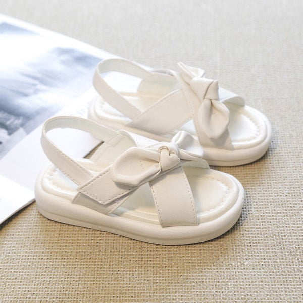 Сандали за момиче с кръстосани каишки и панделка