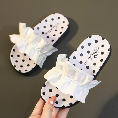 Bērnu čības ar lentīti baltos un melnos punktos