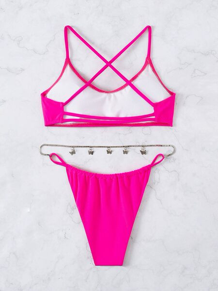 Rózsaszín színű női fürdőruha fém díszítéssel