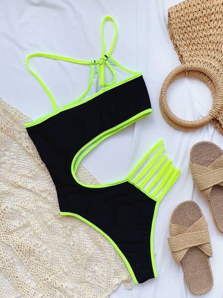 Női teljes fürdőruha kivágásokkal és nyakkendőkkel