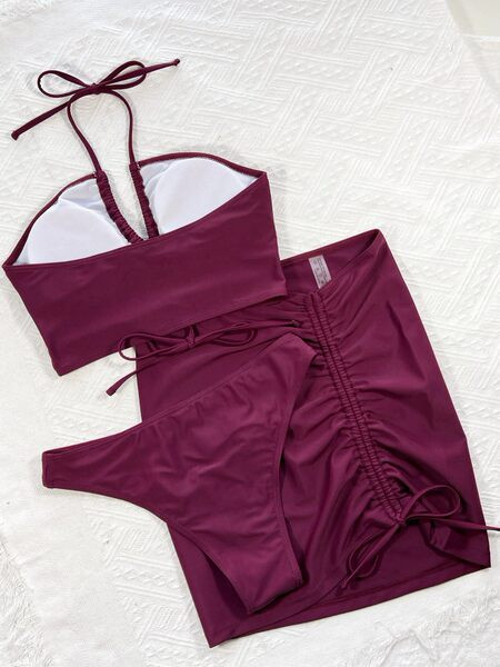 Női fürdőruha új modellje három részből, lila színben