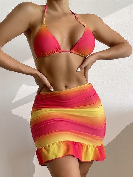 Naiste sillerdavates värvides rannakomplekt - ujumistrikoo ja lokkidega seelik