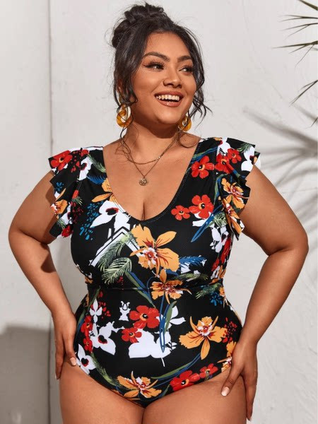 Naiste täisujumistrikoo lillemotiivide ja lokkidega