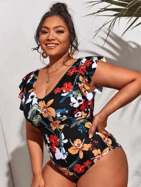 Naiste täisujumistrikoo lillemotiivide ja lokkidega