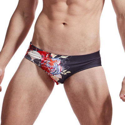 Lillemustriga meeste ujumistrikoo tüüpi põlvpüksid