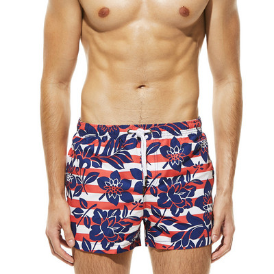 Värvilised lipsude ja lillemotiividega meeste rannapüksid