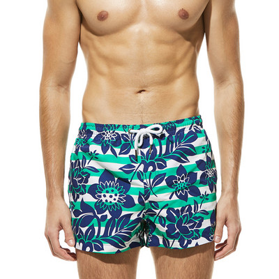 Värvilised lipsude ja lillemotiividega meeste rannapüksid