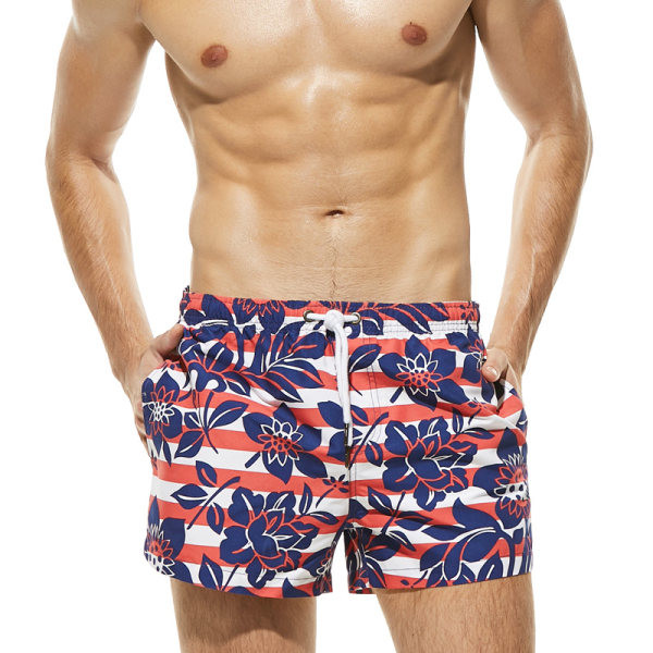 Värvilised lipsude ja lillemotiividega meeste rannapüksid