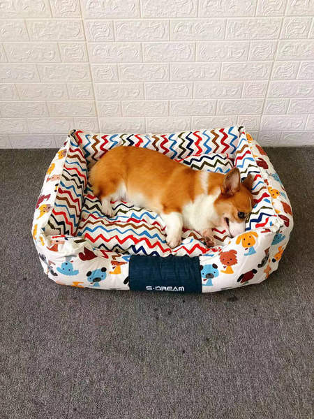 Textile dog bed with removable cover