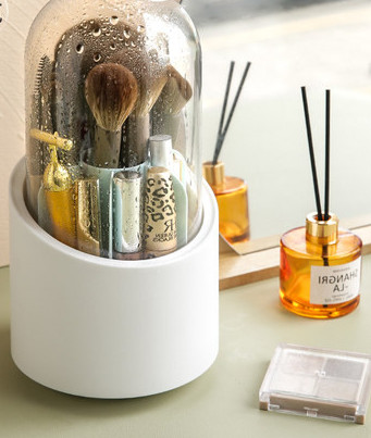 Besisukanti dėžutė šepetėliams ir lūpų dažams laikyti