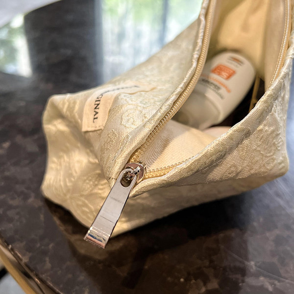 Tekstilna torbica za šminku s patentnim zatvaračem