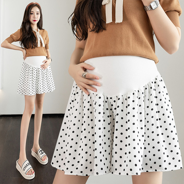 Moderna ženska suknja za trudnice na točkice