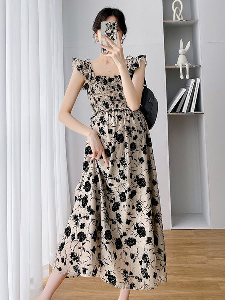 Moderna duga trudnička haljina s cvjetnim motivima i kovrčama