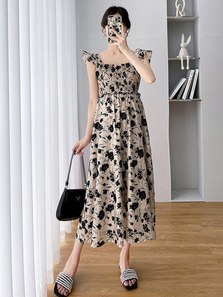 Moderna duga trudnička haljina s cvjetnim motivima i kovrčama