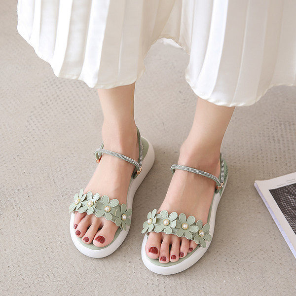 Ženske papuče od eko kože sa ravnim potplatom i perlicama