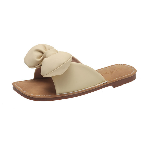 Ženske casual papuče od eko kože s trakom i ravnim potplatom