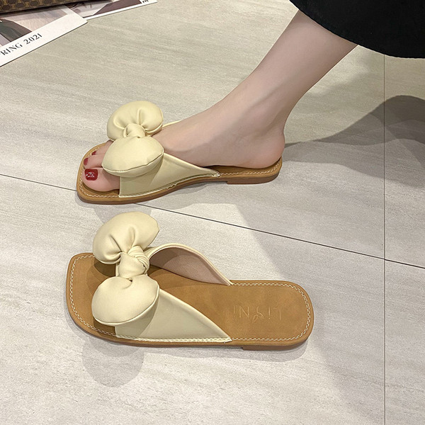 Ženske casual papuče od eko kože s trakom i ravnim potplatom