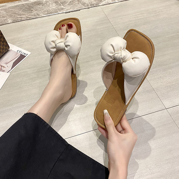 Ženske casual papuče od eko kože s trakom i ravnim potplatom