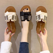 Γυναικείες μοντέρνες παντόφλες από οικολογικό δέρμα με κορδέλα