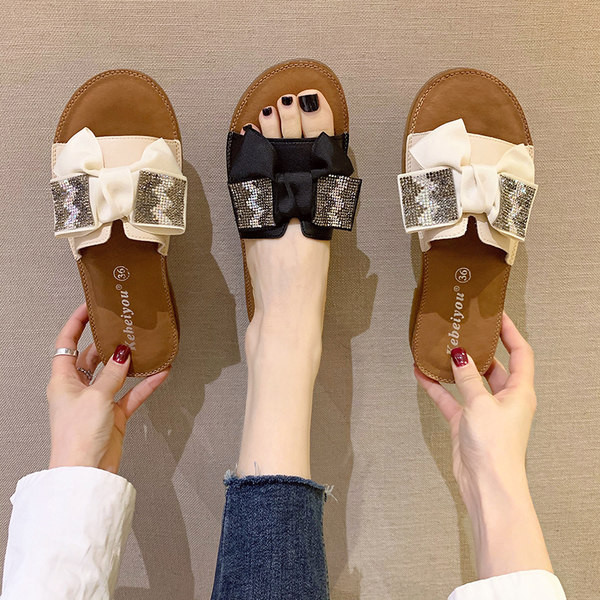 Γυναικείες μοντέρνες παντόφλες από οικολογικό δέρμα με κορδέλα