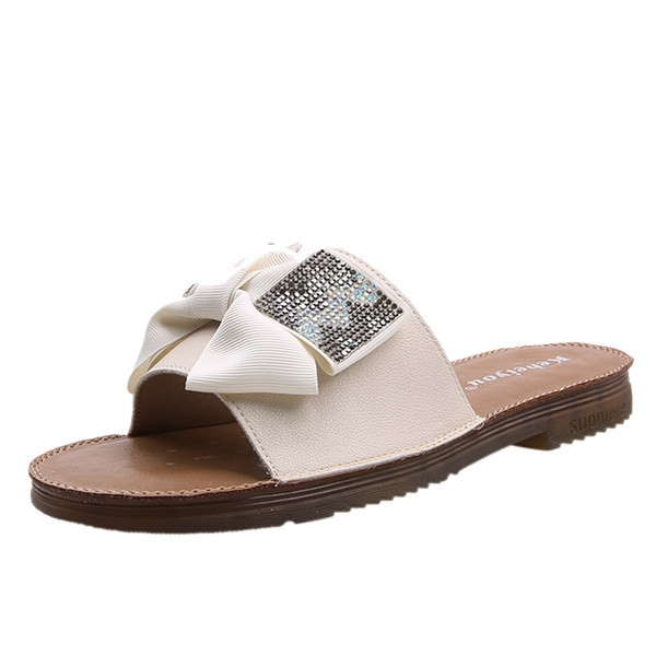 Γυναικείες μοντέρνες παντόφλες από οικολογικό δέρμα με κορδέλα