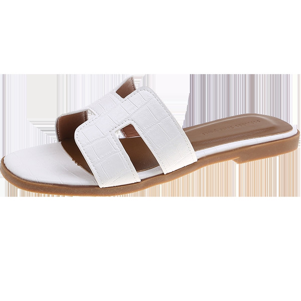 Ženske papuče s ravnim potplatom i remenom od eko kože