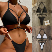 Women`s two-piece swimsuit with laces and pearls