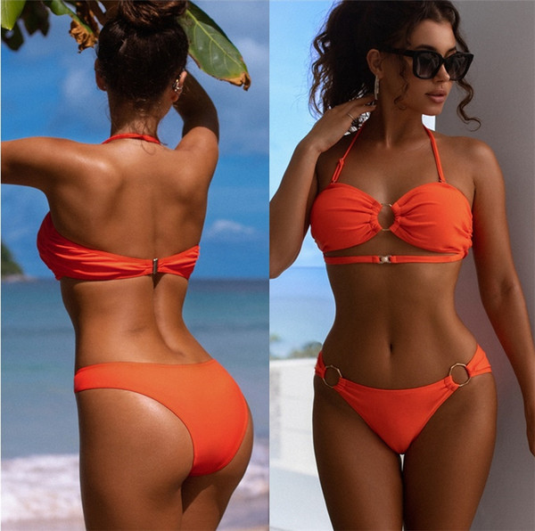 Ženski kupaći kostim s metalnim prstenovima narančaste boje