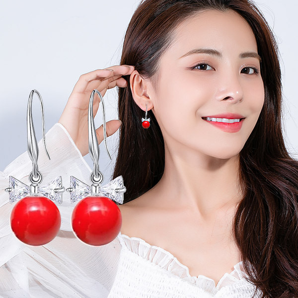 Női fülbevaló piros gyöngyökkel