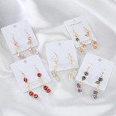 Női fülbevaló arany színű és dekoratív kristályokkal