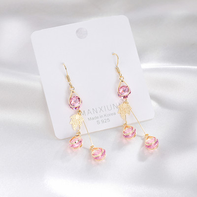 Női fülbevaló arany színű és dekoratív kristályokkal