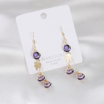 Női fülbevaló arany színű és dekoratív kristályokkal