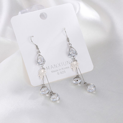 Női fülbevaló arany színű és dekoratív kristályokkal